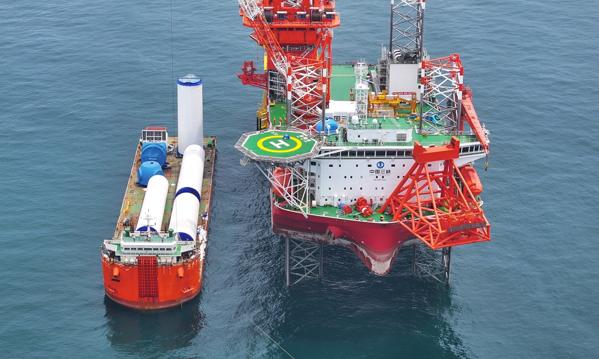 The tower barrels of the 16-megawatt wind turbine are transported to the world's first 2000-ton fourth-generation offshore wind installation platform, the Baihetan, on June 24, 2023. Photo: Courtesy of CTG