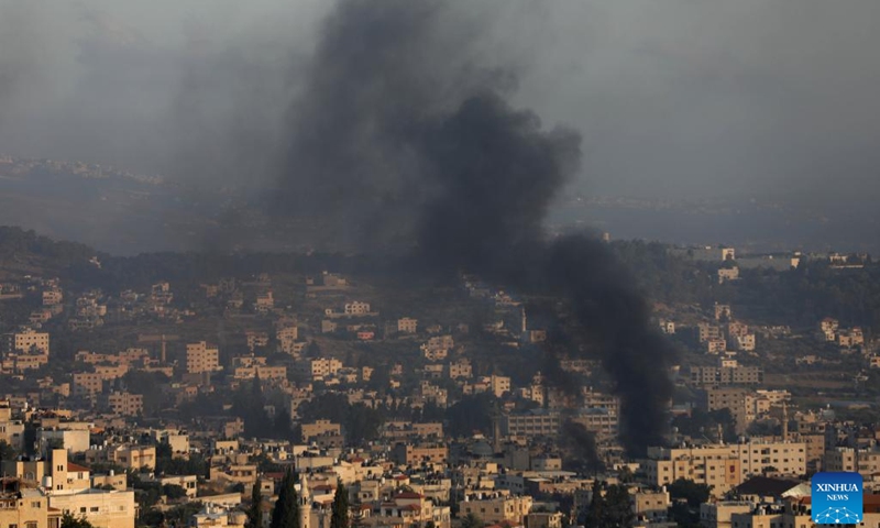 Smoke billows from a refugee camp during an Israeli strike in the West Bank city of Jenin on July 3, 2023. The Israeli army launched a large-scale military strike early on Monday on the northern West Bank city of Jenin, according to eyewitnesses and the Israeli military.(Photo: Xinhua)