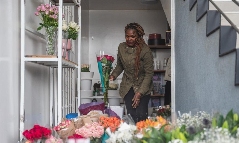 A vendor arranges flowers at a flower shop in Nairobi, Kenya on July 4, 2023. Kenya is one of the world's leading exporters of cut flowers. Its flower exports are among the top foreign exchange sources alongside tea, diaspora remittances and tourism.((Photo: Xinhua)