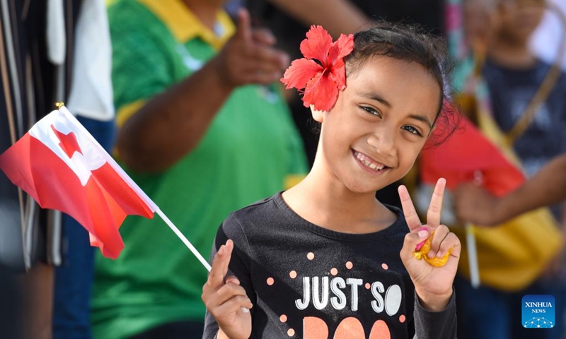 A girl gestures while watching a float parade in Nuku'alofa, Tonga, on July 4, 2023. Tongan King Tupou VI's official birthday, observed on July 4 each year, is a public holiday in the country.((Photo: Xinhua)