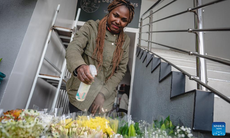 A vendor waters flowers at a flower shop in Nairobi, Kenya on July 4, 2023. Kenya is one of the world's leading exporters of cut flowers. Its flower exports are among the top foreign exchange sources alongside tea, diaspora remittances and tourism.((Photo: Xinhua)