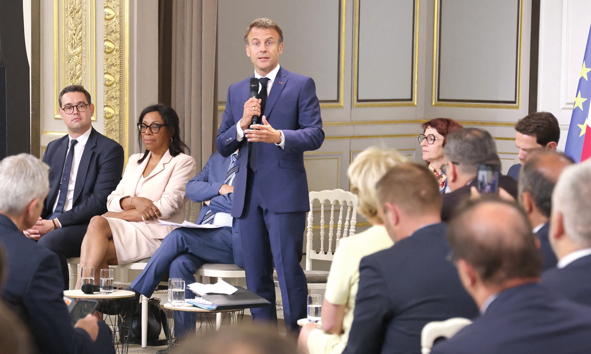 French President Emmanuel Macron addresses mayors of cities affected by the violent clashes that erupted after a teenager was shot dead by police on June 27, 2023 in Nanterre, at a meeting at the presidential Elysee Palace in Paris on July 4, 2023. He said 