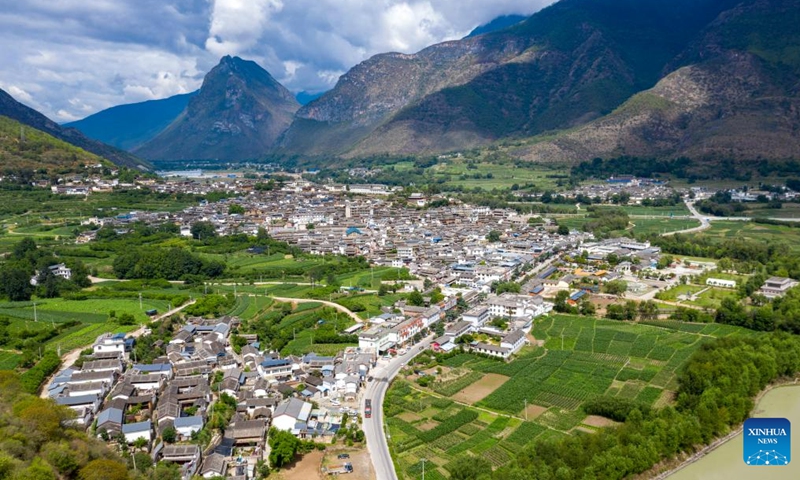 This aerial photo taken on June 20, 2023 shows a view of Shigu Town of Lijiang City, southwest China's Yunnan Province. Shigu Town of Lijiang City is located by a huge bend of the Jinsha River, the upper section of the Yangtze River in southwest China. The footprints of the Red Army are forever engraved in the town's culture and spirits.(Photo: Xinhua)