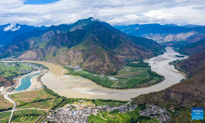 This aerial photo taken on June 15, 2023 from Shigu Town of Lijiang City shows a bend of the Jinsha River in southwest China's Yunnan Province. Shigu Town of Lijiang City is located by a huge bend of the Jinsha River, the upper section of the Yangtze River in southwest China. The footprints of the Red Army are forever engraved in the town's culture and spirits.(Photo: Xinhua)