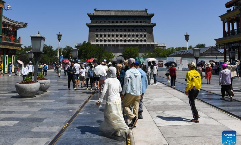 People visit the Qianmen street in Beijing, capital of China, July 6, 2023. Beijing issued a red alert for high temperatures on Thursday, the highest in a color-coded alert system, as temperatures in most parts of the city are expected to rise above 40 degrees Celsius. This is the second red alert for high temperatures issued by the national capital this summer.(Photo: Xinhua)