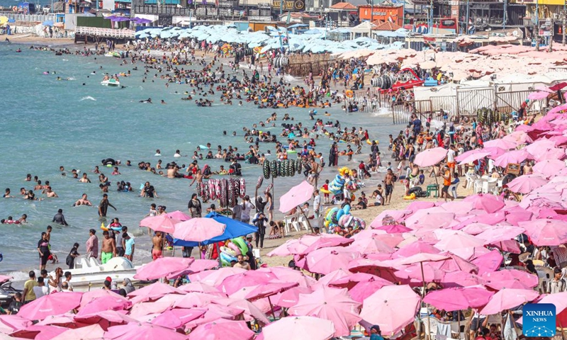 People cool off at a beach of the Mediterranean sea during a heatwave in Alexandria, Egypt, on July 6, 2023.(Photo: Xinhua)