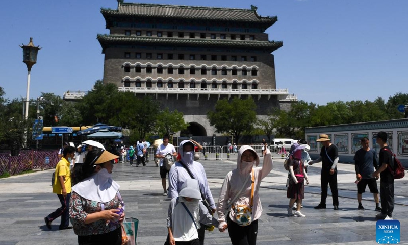 People visit the Qianmen street in Beijing, capital of China, July 6, 2023. Beijing issued a red alert for high temperatures on Thursday, the highest in a color-coded alert system, as temperatures in most parts of the city are expected to rise above 40 degrees Celsius. This is the second red alert for high temperatures issued by the national capital this summer.(Photo: Xinhua)