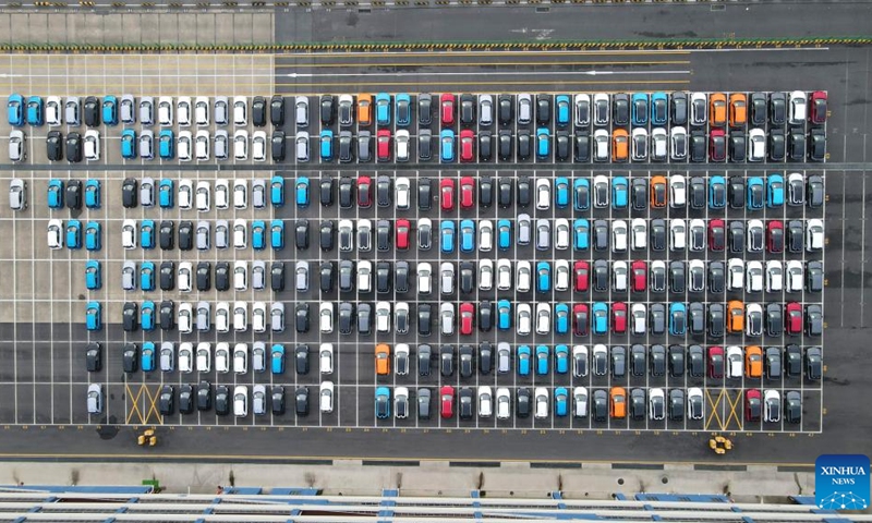 This aerial photo taken on July 9, 2023 shows MG cars produced by Shanghai Automotive Industry Corp (SAIC) to be shipped to Australia at Shanghai Haitong International Automotive Terminal in Waigaoqiao of east China's Shanghai. The Waigaoqiao Haitong pier is one of China's largest auto-export terminals.(Photo: Xinhua)