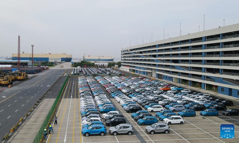 This aerial photo taken on July 9, 2023 shows MG cars produced by Shanghai Automotive Industry Corp (SAIC) to be shipped to Australia at Shanghai Haitong International Automotive Terminal in Waigaoqiao of east China's Shanghai. The Waigaoqiao Haitong pier is one of China's largest auto-export terminals.(Photo: Xinhua)