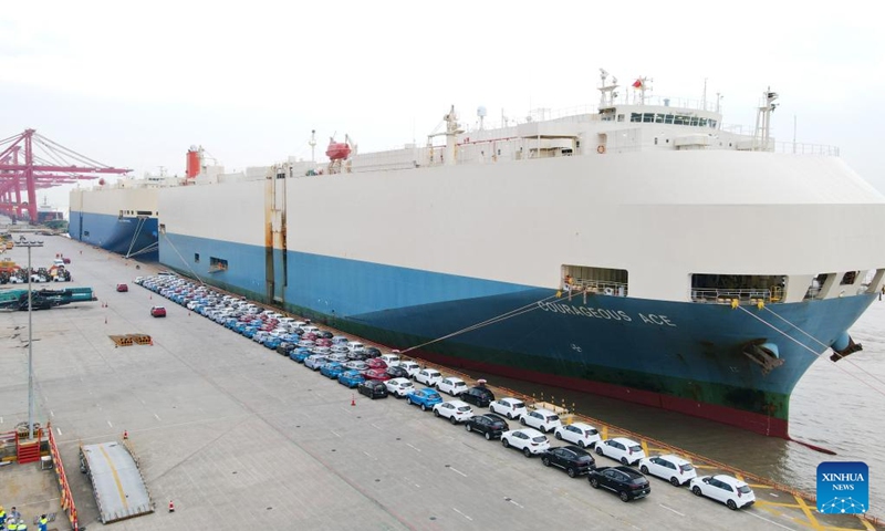 This aerial photo taken on July 9, 2023 shows MG cars produced by Shanghai Automotive Industry Corp (SAIC) to be shipped to Australia at Shanghai Haitong International Automotive Terminal in Waigaoqiao of east China's Shanghai. The Waigaoqiao Haitong pier is one of China's largest auto-export terminals.(Photo: Xinhua)