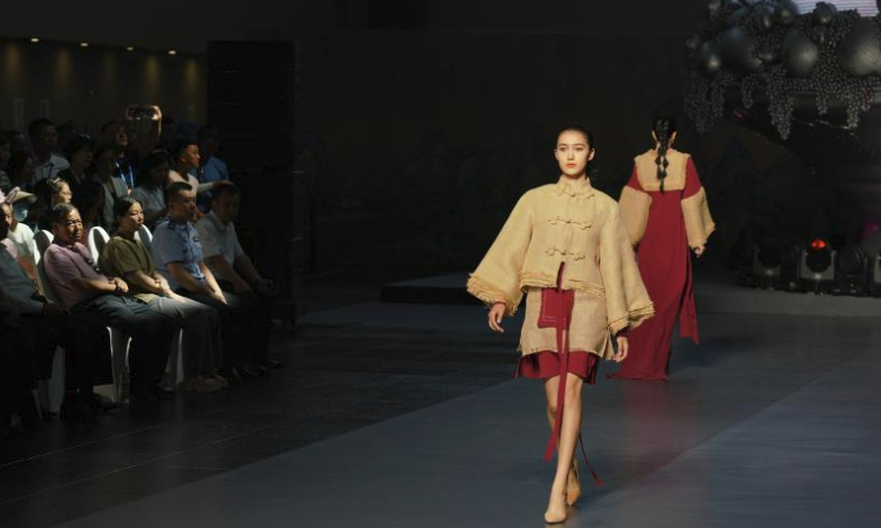 Models present creations during a fashion show on the sidelines of the 6th China Xinjiang International Dance Festival, in Urumqi, northwest China's Xinjiang Uygur Autonomous Region, July 22, 2023. (Xinhua/Zhang Xiaocheng)