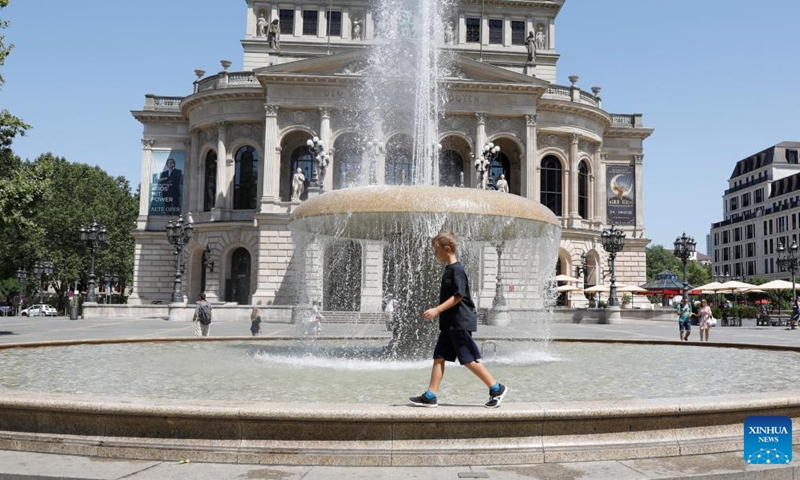 A boy plays at a fountain in Frankfurt, Germany, on July 8, 2023. (Xinhua/Zhang Fan)