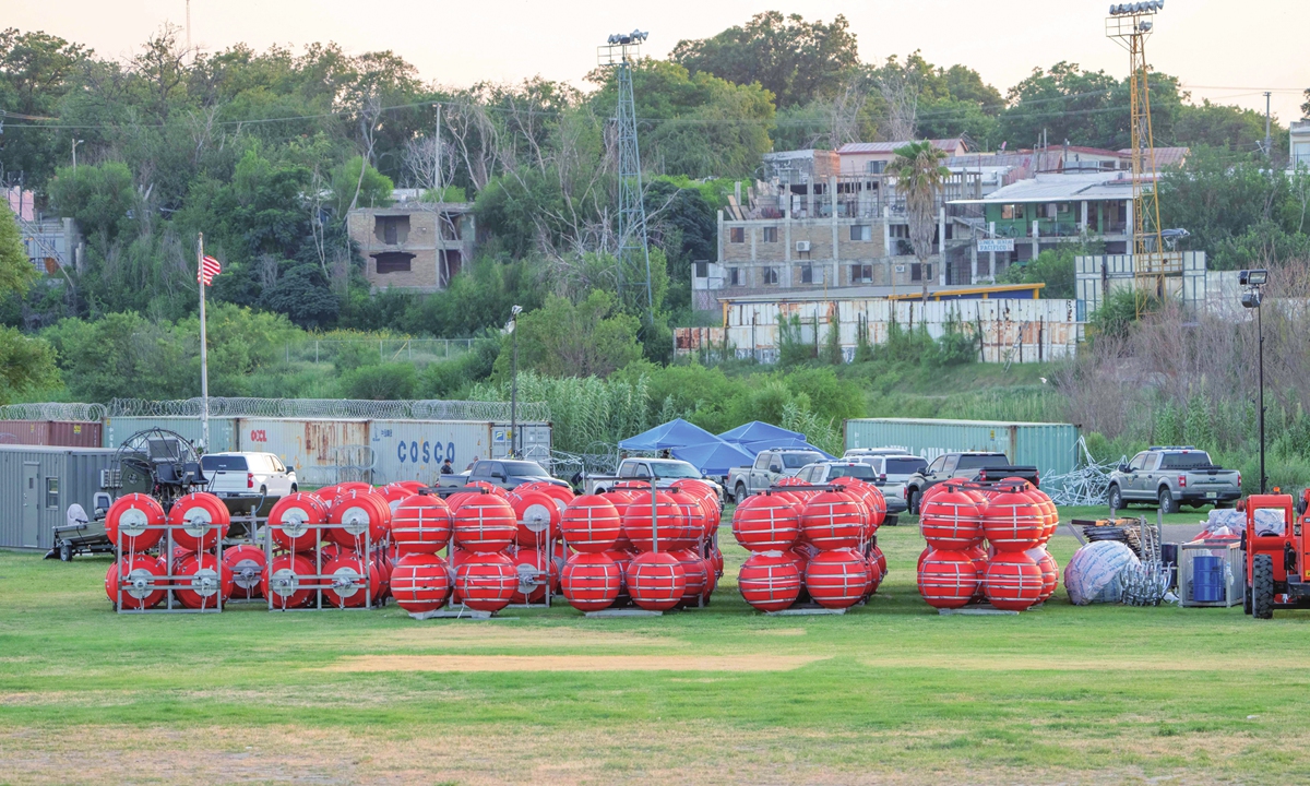 Buoy barriers are prepared for installation during a water-based border operation on July 8, 2023 in Eagle Pass, Texas. Texas has begun installing buoy barriers along portions of the Rio Grande river in an effort to deter illegal border crossings. Photo: VCG