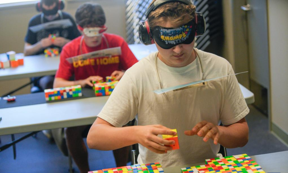 A contestant solves a Rubik's Cube blindfolded during the Canadian Speedcubing Championship 2023 at the Queen's Park Arena in New Westminster, British Columbia, Canada, on July 13, 2023. A total of 320 contestants from 20 countries and regions took part in the championship from July 13 to 16. Photo:Xinhua