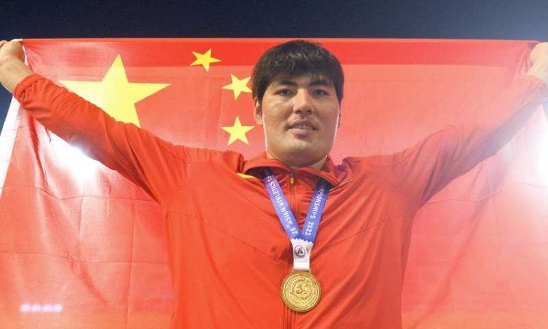 Abuduaini Tuergong of China celebrates after the awarding ceremony for the men's discus throw final at the 25th Asian Athletics Championships in Bangkok, Thailand, July 15, 2023. (Xinhua/Rachen Sageamsak)