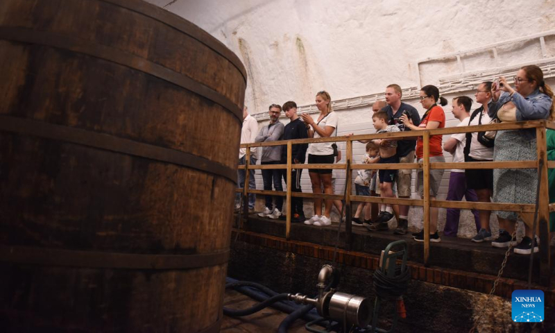 Visitors have a tour at Pilsner Urquell brewery in Pilsen, the Czech Republic, July 22, 2023. (Xinhua/He Canling)