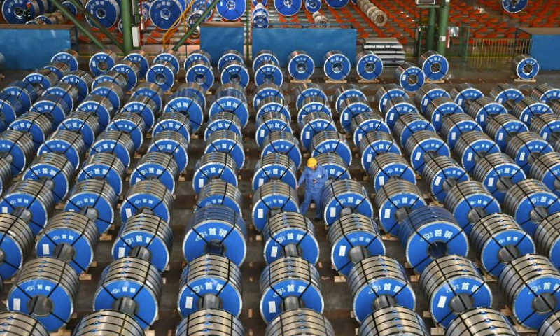 A staff member works at a warehouse of Shougang Jingtang United Iron & Steel Co., Ltd. in Tangshan, north China's Hebei Province, July 22, 2023. Tangshan has continued to promote the optimizing of steel industry in recent years, contributing to the high-quality development of the economy. (Xinhua/Zhu Xudong)