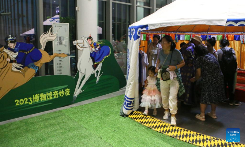 People visit a night fair at Minhang Museum of Shanghai in east China to experience the traditional Mongolian custom, July 21, 2023. (Xinhua/Xin Mengchen)