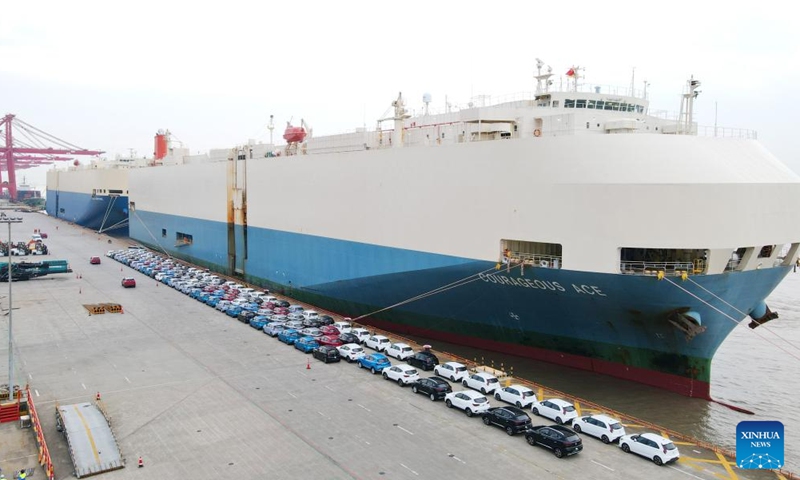 This aerial photo taken on July 9, 2023 shows MG cars produced by Shanghai Automotive Industry Corp (SAIC) to be shipped to Australia at Shanghai Haitong International Automotive Terminal in Waigaoqiao of east China's Shanghai. The Waigaoqiao Haitong pier is one of China's largest auto-export terminals. (Xinhua/Fang Zhe)