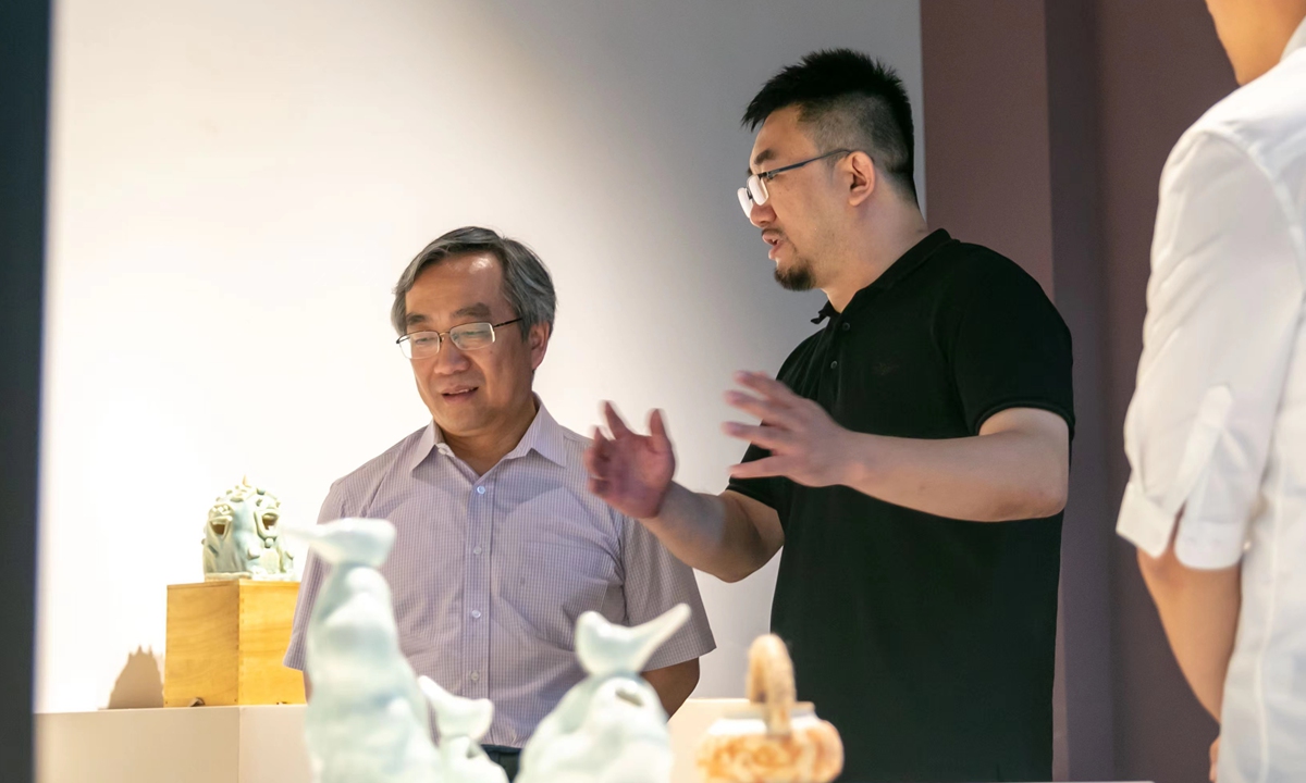 Qin Chuan (left), secretary of CPC committee of the Academy of Arts and Design, Tsinghua University at the exhibition Photo: Courtesy of AADTHU