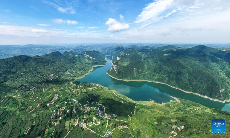 This aerial photo taken on July 11, 2023 shows a view of a section of the Wujiang River in Zhucang Township of Weng'an County, southwest China's Guizhou Province. Lu and Ran are local villagers who grew up along the Wujiang River and got married in 1986. For decades, the couple took the initiative to clean up the floating garbage along the Wujiang River and promote environmental protection while working on ferries.(Photo: Xinhua)