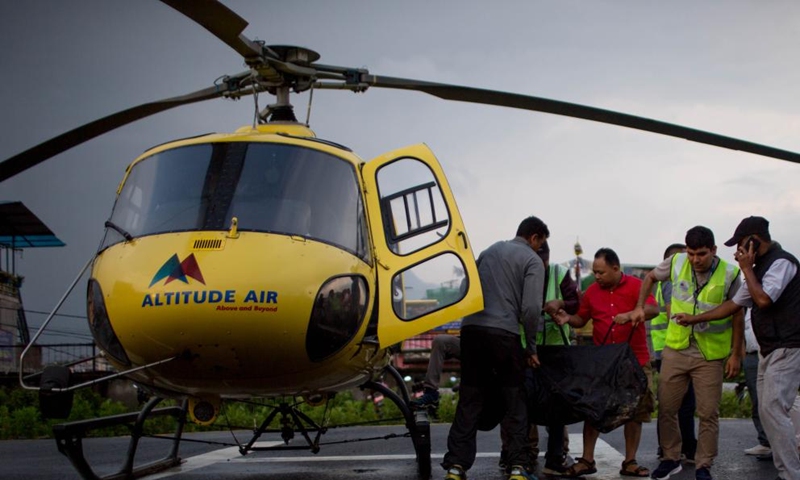 Bodies of six victims of a helicopter crash are airlifted to Kathmandu, Nepal, on July 11, 2023. All six people, including five Mexican tourists and a Nepali pilot, were killed after their helicopter crashed on Tuesday in a mountain district in eastern Nepal, the authorities said.(Photo: Xinhua)