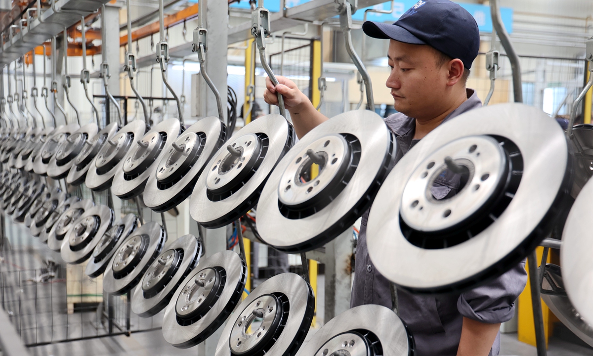 A staffer works on the production line of an auto parts manufacturer in Binzhou, East China's Shandong Province, on July 10, 2023. Since the beginning of this year, market demand for auto parts for enterprises in Binzhou has been substantial, and the production capacity has remained consistently high. In the first quarter, the added value of the city's auto manufacturing industry rose by 14.8 percent year-on-year. Photo: cnsphoto