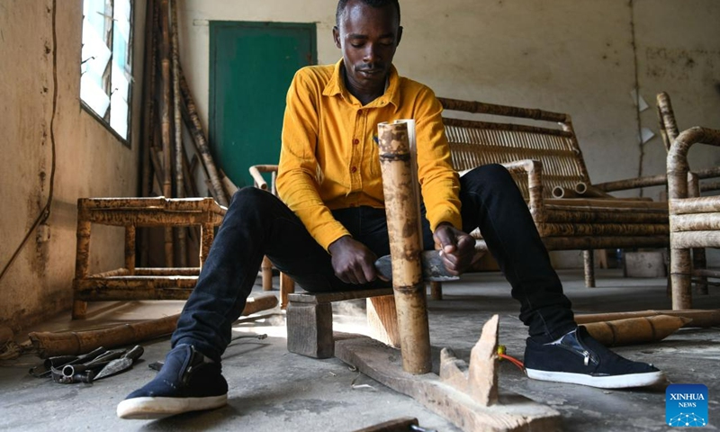 A trainee makes bamboo furniture at Kamenge handicraft vocational training center in Bujumbura, Burundi, June 21, 2023. Teams of Chinese experts have been conducting vocational training on handicrafts such as rattan weaving, bamboo weaving, and woodworking in Burundi since 1985(Photo: Xinhua)