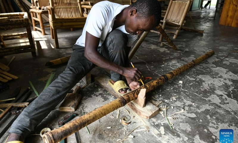 A trainee makes bamboo furniture at Kamenge handicraft vocational training center in Bujumbura, Burundi, June 21, 2023. Teams of Chinese experts have been conducting vocational training on handicrafts such as rattan weaving, bamboo weaving, and woodworking in Burundi since 1985.(Photo: Xinhua)