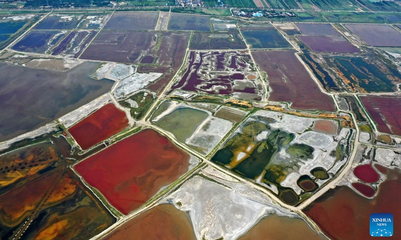 This aerial photo taken on July 11, 2023 shows the Salt Lake in Yuncheng City, north China's Shanxi Province. Yuncheng Salt Lake has a history of over 4,600 years of exploitation, with profound cultural heritage and significant historical value. In recent years, local authority has insisted on giving priority to protection and green development and stopped all industrial production within the protection area of the lake, in a bid to promote industrial transformation and upgrading according to local conditions.(Photo: Xinhua)