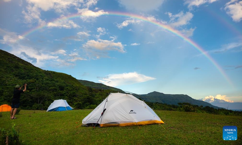 This photo taken on July 8, 2023 shows a rainbow at the Nam Ngum Lake in Vientiane Province, Laos. The Nam Ngum Lake, located at the lower reaches of the Nam Ngum River, a tributary of Mekong River, is known as the thousand-island lake in Laos.(Photo: Xinhua)