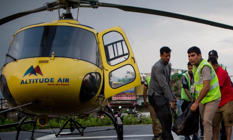 Bodies of six victims of a helicopter crash are airlifted to Kathmandu, Nepal, on July 11, 2023. All six people, including five Mexican tourists and a Nepali pilot, were killed after their helicopter crashed on Tuesday in a mountain district in eastern Nepal, the authorities said.(Photo: Xinhua)