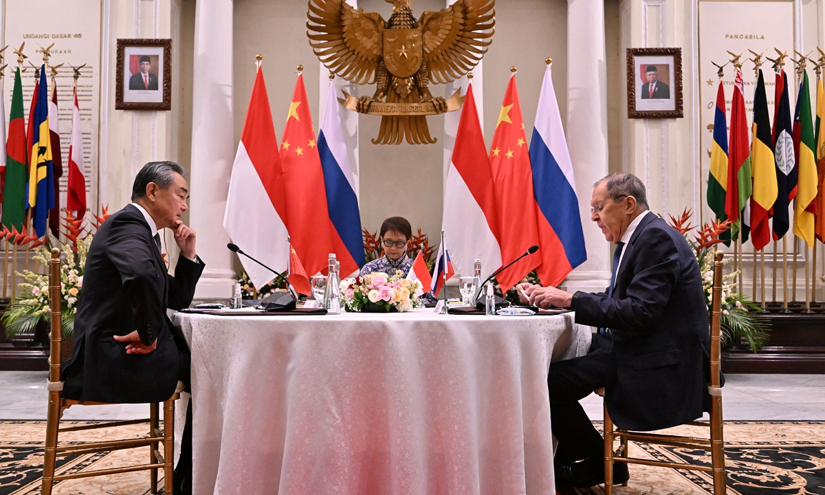 

Wang Yi (left), director of the Office of the Foreign Affairs Commission of the Communist Party of China Central Committee, speaks with Indonesia's Foreign Minister Retno Marsudi (center) and Russia's Foreign Minister Sergey Lavrov during the trilateral meeting at the Foreign Ministry office in Jakarta on July 12, 2023. The 56th Association of Southeast Asian Nations (ASEAN) Foreign Ministers' Meeting kicked off on July 11. Photo: AFP