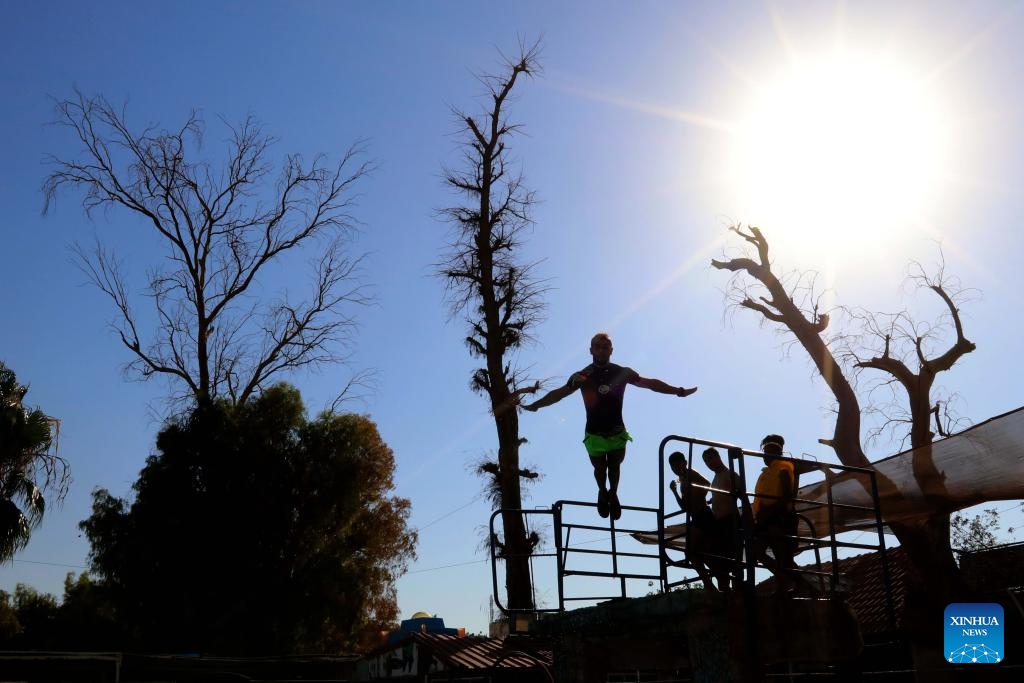 A man dives into a swimming pool during a heat wave in Zarqa, east of Amman, Jordan, on July 12, 2023.(Photo: Xinhua)