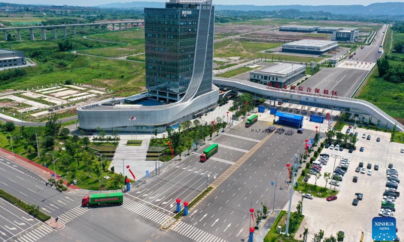 This aerial photo taken on July 11, 2023 shows trucks carrying auto parts of the Great Wall Motor Company Limited departing from the Chongqing Yongchuan Comprehensive Bonded Zone in southwest China's Chongqing Municipality to export to Thailand and Ecuador.

In recent years, Chongqing Municipality has accelerated the building of new energy vehicle (NEV) industrial clusters. At present, production lines of NEV industry in Chongqing are operating at full swing to meet the domestic and international market demand.
 (Xinhua/Tang Yi)