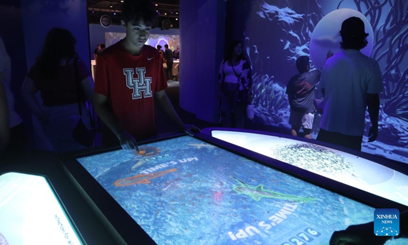 People visit an exhibition titled Sharks! The Meg, The Monsters & The Myths held at the Houston Museum of Natural Science in Texas, the United States, July 23, 2023. (Xinhua/Xu Jianmei)