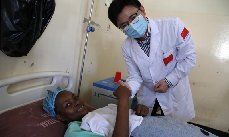 Zhang Hao, head of the Chinese medical team and a pancreatic surgeon, bumps fists with a patient after complex liver cancer resection at a ward of the Maputo Central Hospital in Maputo, Mozambique, July 27, 2023. The 24th Chinese medical team dispatched to Mozambique has been providing medical services at the Maputo Central Hospital since October 2022. The Chinese government has been sending medical teams to Mozambique since 1976. (Xinhua/Dong Jianghui)