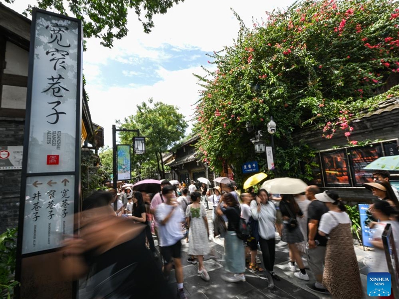 Tourists visit the Kuanzhai Alley Historic District in Chengdu of southwest China's Sichuan Province, on July 14, 2023. The 31st FISU Summer World University Games is scheduled to take place in Chengdu from July 28 to August 8, 2023. (Xinhua/Wang Xi)