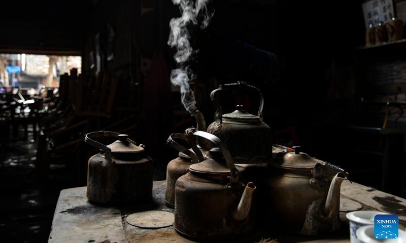 This photo taken on Nov. 23, 2021 shows the hot water kettles in a tea house in Chengdu of southwest China's Sichuan Province. The 31st FISU Summer World University Games is scheduled to take place in Chengdu from July 28 to August 8, 2023. (Xinhua/Shen Bohan)