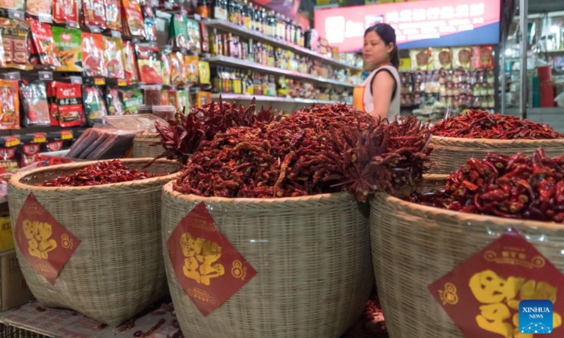 Red peppers are seen at a shop in Chengdu of southwest China's Sichuan Province, on July 14, 2023. The 31st FISU Summer World University Games is scheduled to take place in Chengdu from July 28 to August 8, 2023. (Xinhua/Tang Wenhao)