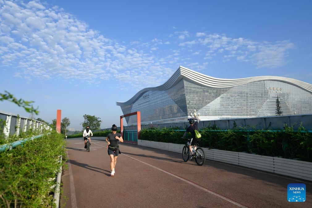 People do exercise at Tianfu Greenway in Chengdu, capital of southwest China's Sichuan Province, July 16, 2023. The 31st International University Sports Federation (FISU) Summer World University Games will be held in Chengdu from July 28 to August 8.(Photo: Xinhua)