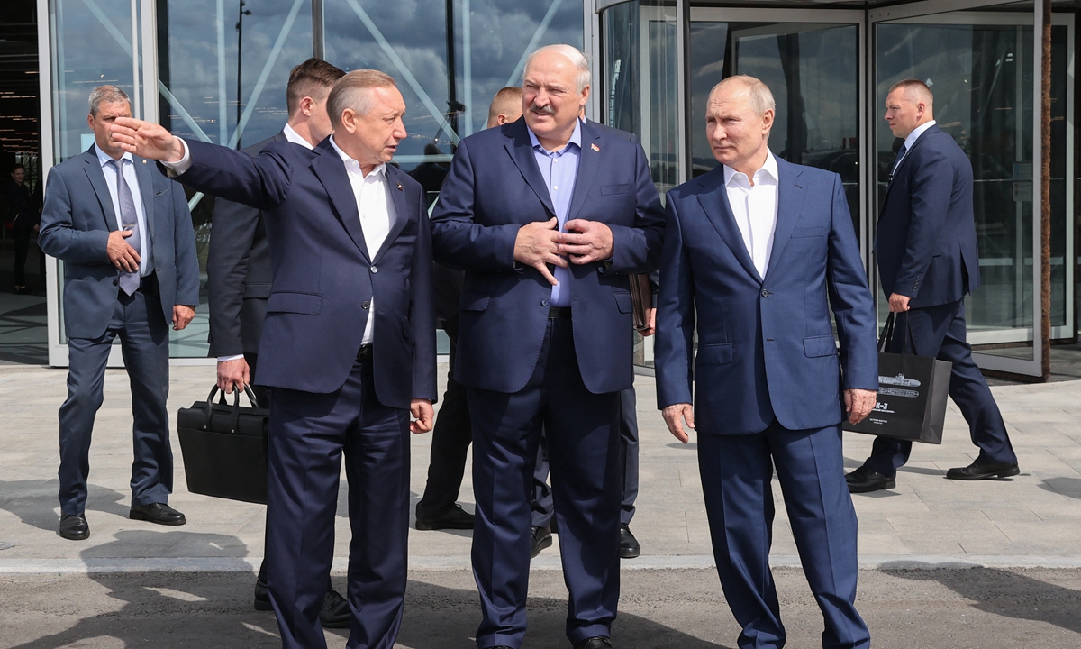 Russian President Vladimir Putin (right) and Belarusian President Alexander Lukashenko (center) meet with Governor of Saint Petersburg Alexander Beglov (left) during a visit to Kronstadt, on Kotlin Island, outside Saint Petersburg, on July 23, 2023. Putin said Ukraine's counteroffensive 