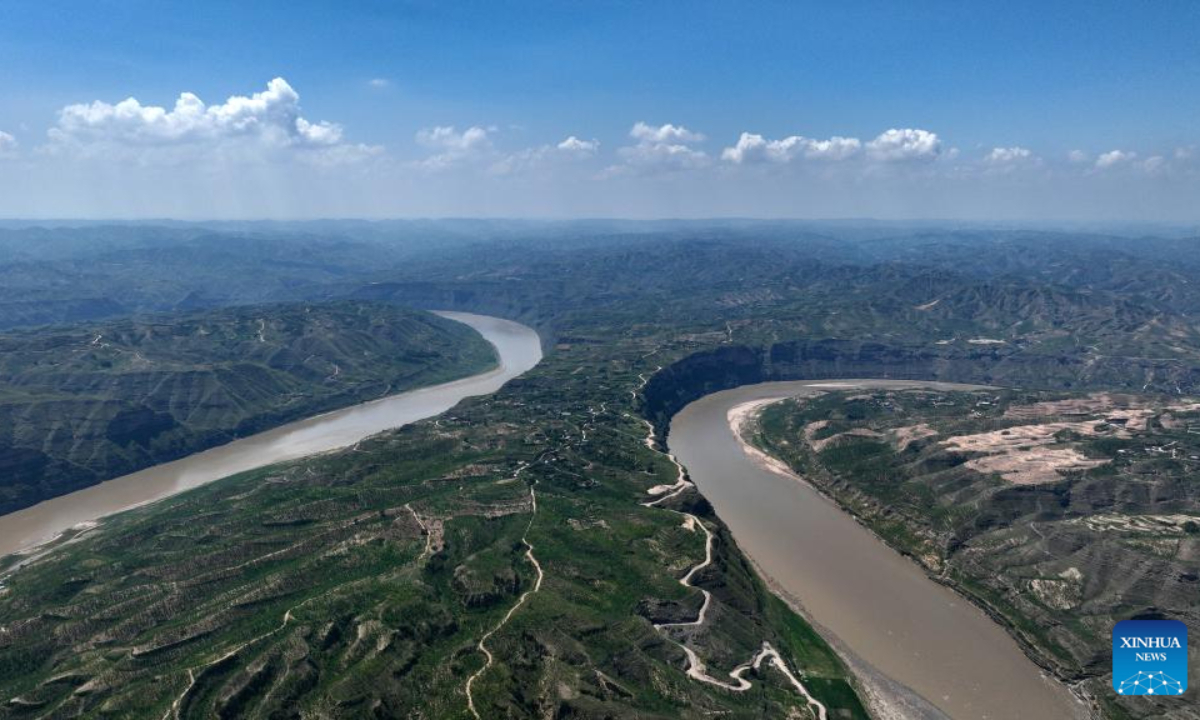 This aerial photo taken on Aug 3, 2023 shows a scene of a turning of the Yellow River in the border area between Shilou County of north China's Shanxi Province and Qingjian County of northwest China's Shaanxi Province. Photo:Xinhua