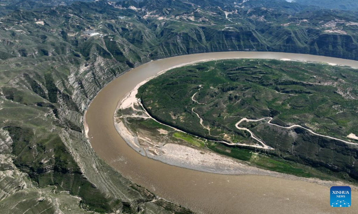 This aerial photo taken on Aug 3, 2023 shows a scene of a turning of the Yellow River in the border area between Shilou County of north China's Shanxi Province and Qingjian County of northwest China's Shaanxi Province. Photo:Xinhua