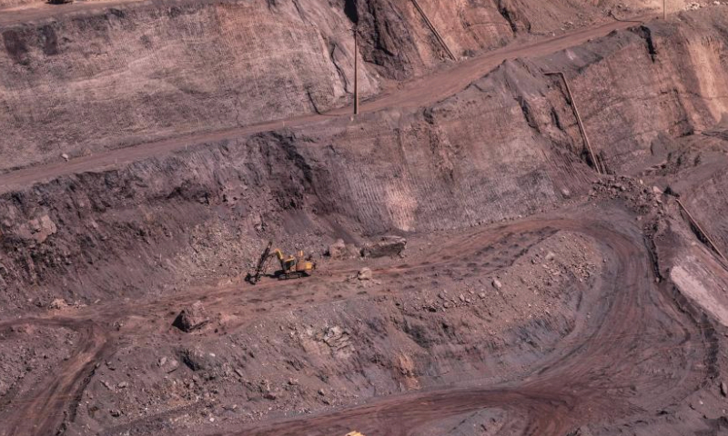 This aerial photo taken on Aug. 3, 2023 shows machinery working at the Carajas Mine, one of the world's largest iron ore mines, in the state of Para in Brazil. (Xinhua/Wang Tiancong)