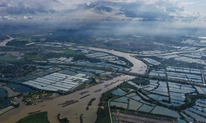 This aerial photo taken on July 23, 2023 shows an aquaculture farm in Qinzhou, south China's Guangxi Zhuang Autonomous Region. Qinzhou is a node of the New International Land-Sea Trade Corridor connecting Guangxi and ASEAN countries, and its location is highly beneficial, granting the city an important role in international land-sea transport connectivity. (Xinhua/Cao Yiming)

