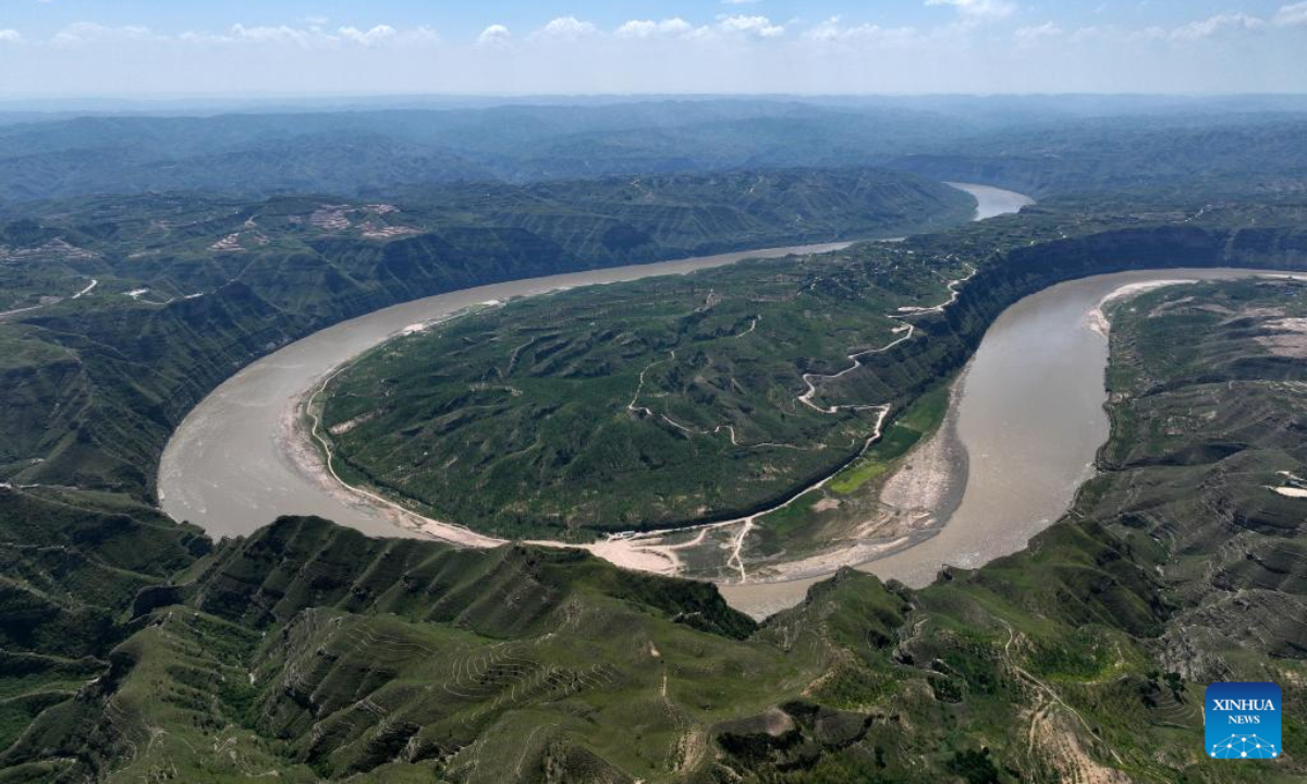 This aerial photo taken on Aug 3, 2023 shows a scene of a turning of the Yellow River in the border area between Shilou County of north China's Shanxi Province and Qingjian County of northwest China's Shaanxi Province. Photo:Xinhua