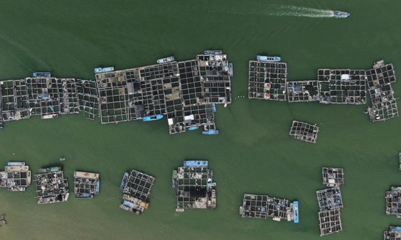 This aerial photo taken on July 28, 2023 shows marine net cages in Raoping County in Chaozhou, south China's Guangdong Province. Raoping County has a long history of aquaculture. By 2022, the county has aquaculture area of 179,000 mu (about 11,933 hectares) and more than 100 aquatic products enterprises with about 4,200 employees. (Xinhua/Wang Ruiping)