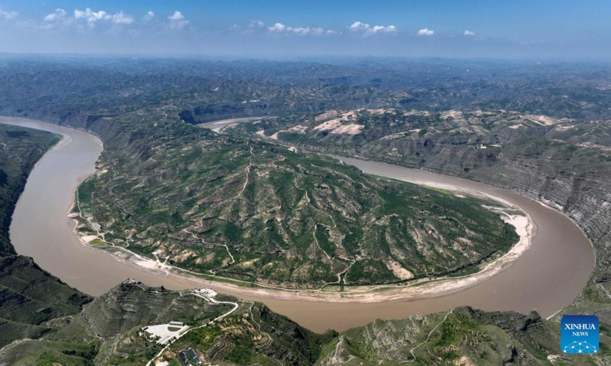 This aerial photo taken on Aug 3, 2023 shows a scene of a turning of the Yellow River in the border area between Shilou County of north China's Shanxi Province and Qingjian County of northwest China's Shaanxi Province. Photo:Xinhua