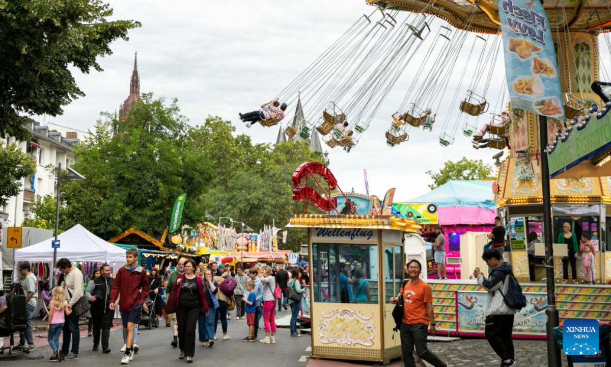 People enjoy themselves at the site of Main Festival in Frankfurt, Germany, Aug 4, 2023. The Main Festival is one of Frankfurt's oldest and most traditional folk fairs. Photo:Xinhua